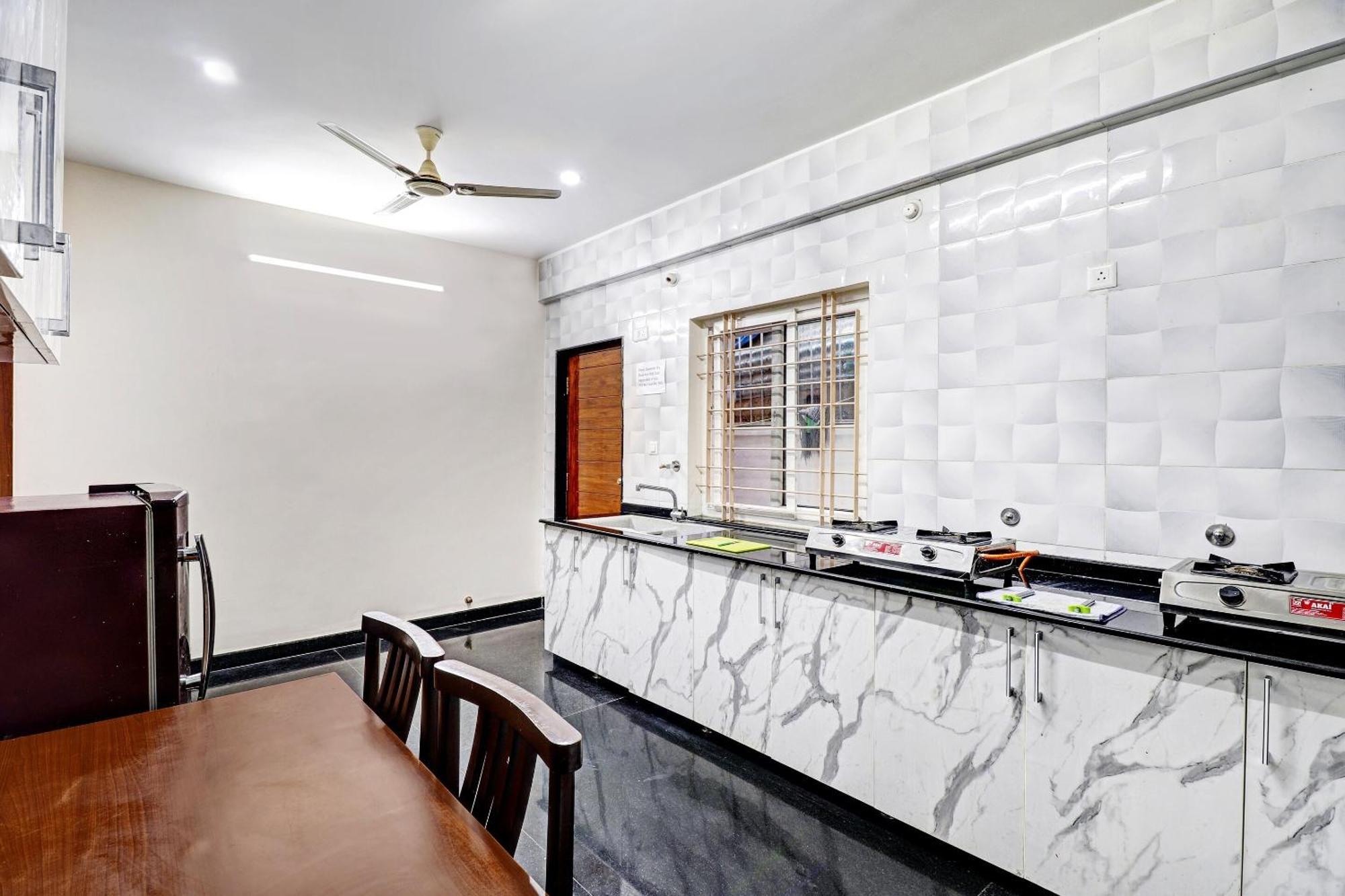 Capital O R R Residency Hotel