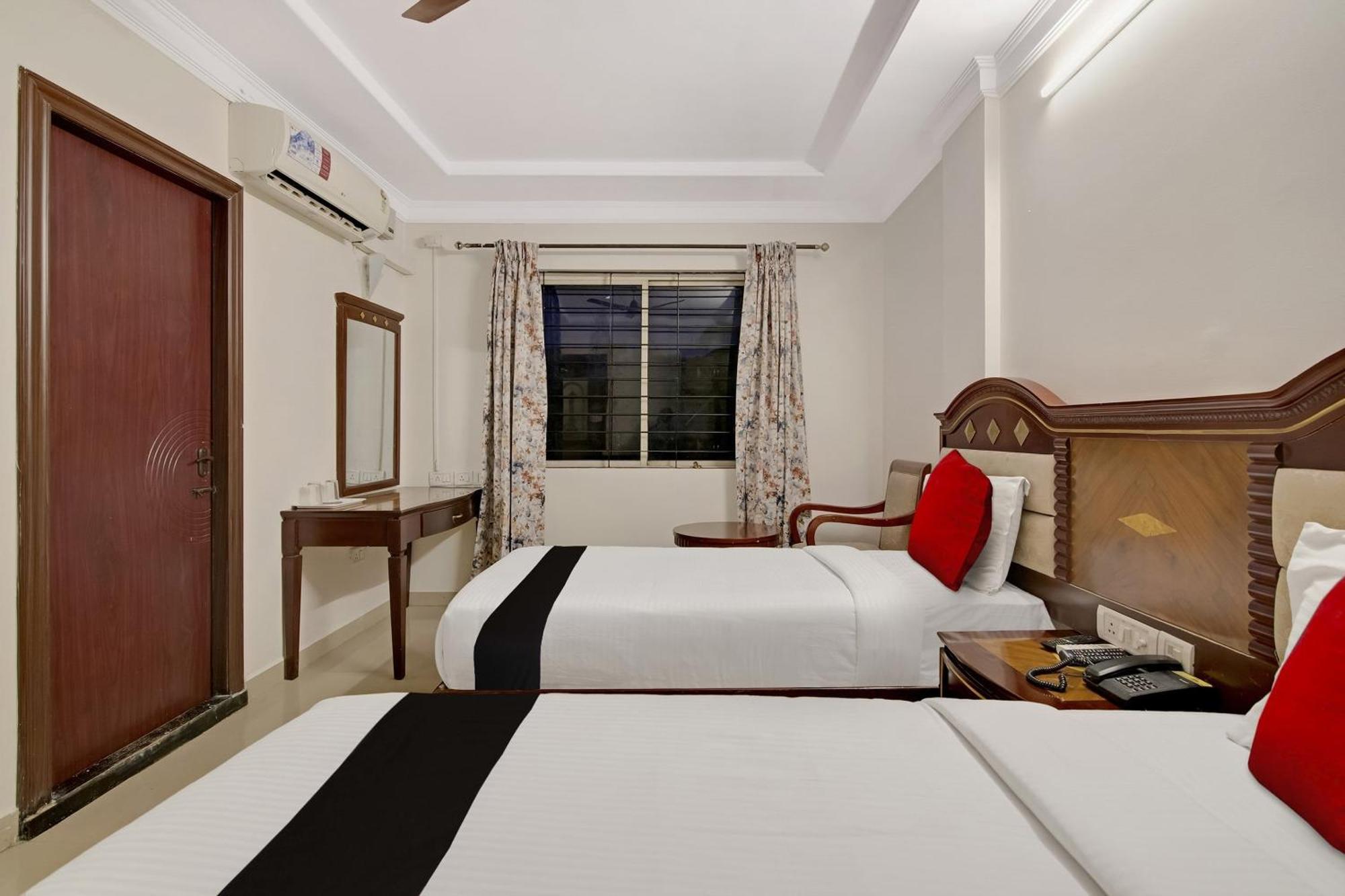 Hotel Capital O Elegant Amethyst Business Near Ragigudda Sri Prasanna Anjaneyaswamy Temple Bangalore