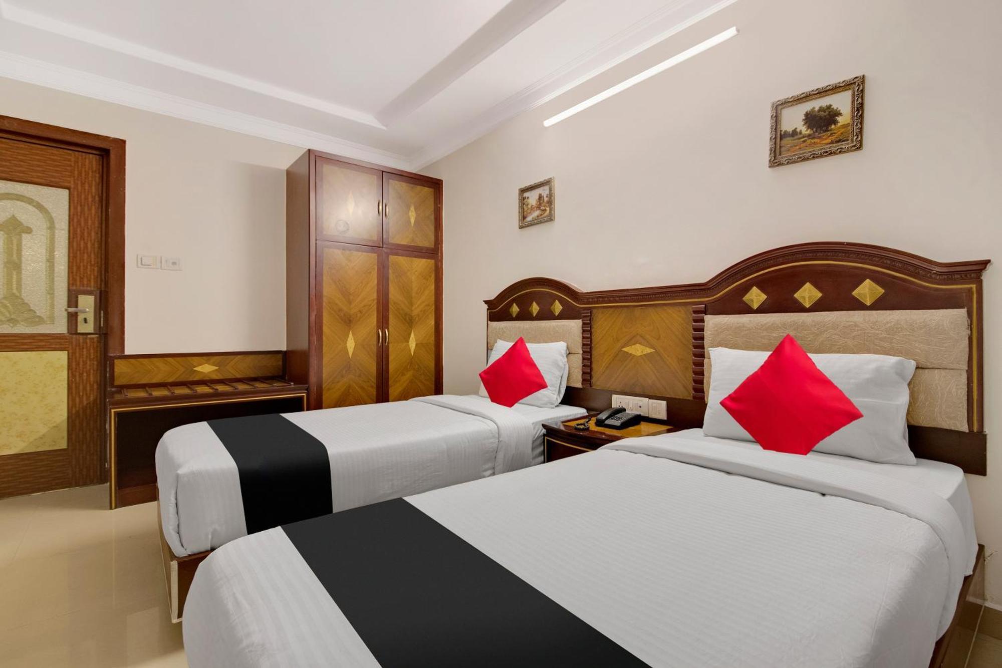 Hotel Capital O Elegant Amethyst Business Near Ragigudda Sri Prasanna Anjaneyaswamy Temple