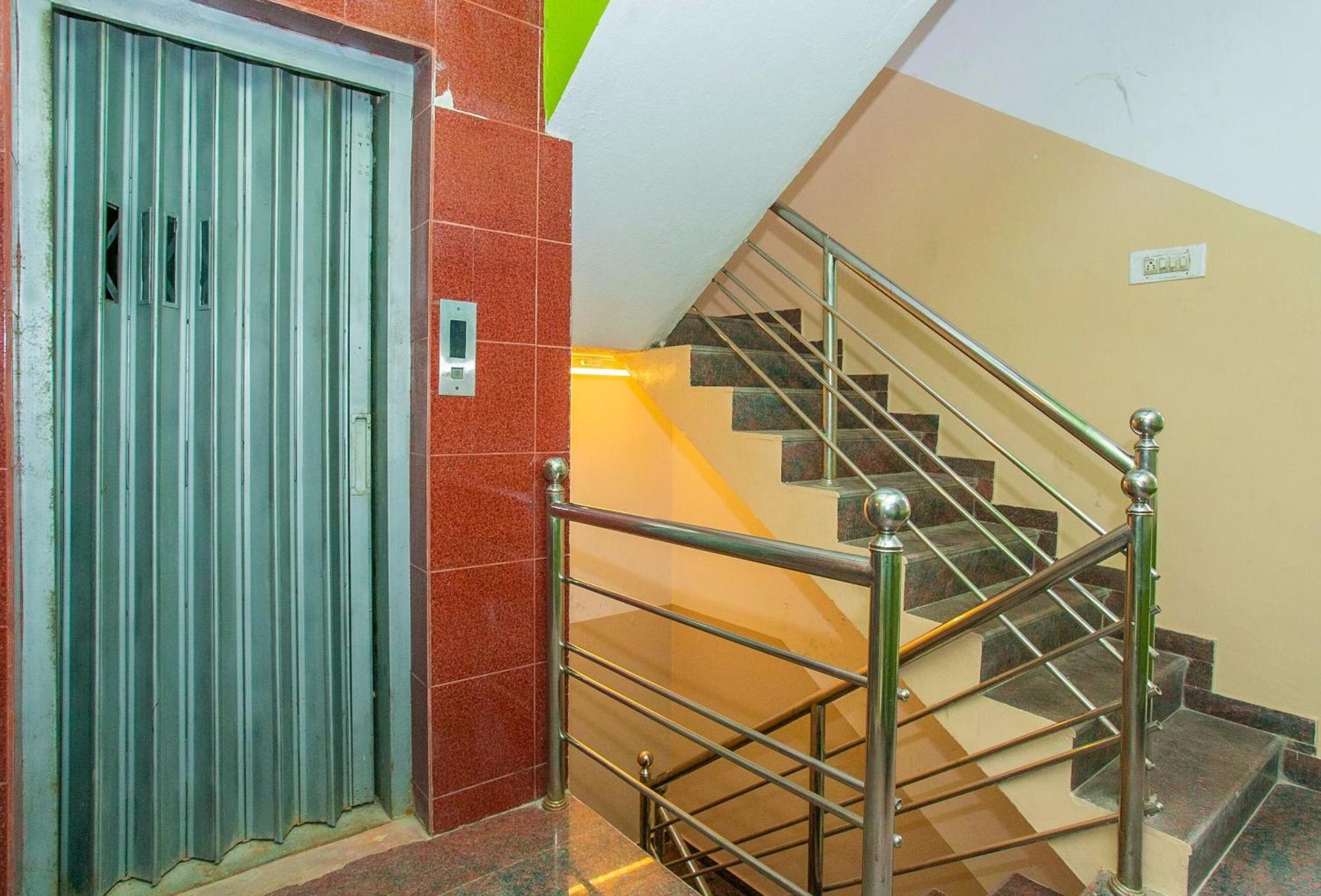 Hotel O Sri Hari Premium Comforts Near Sandhya Digital K Theatre